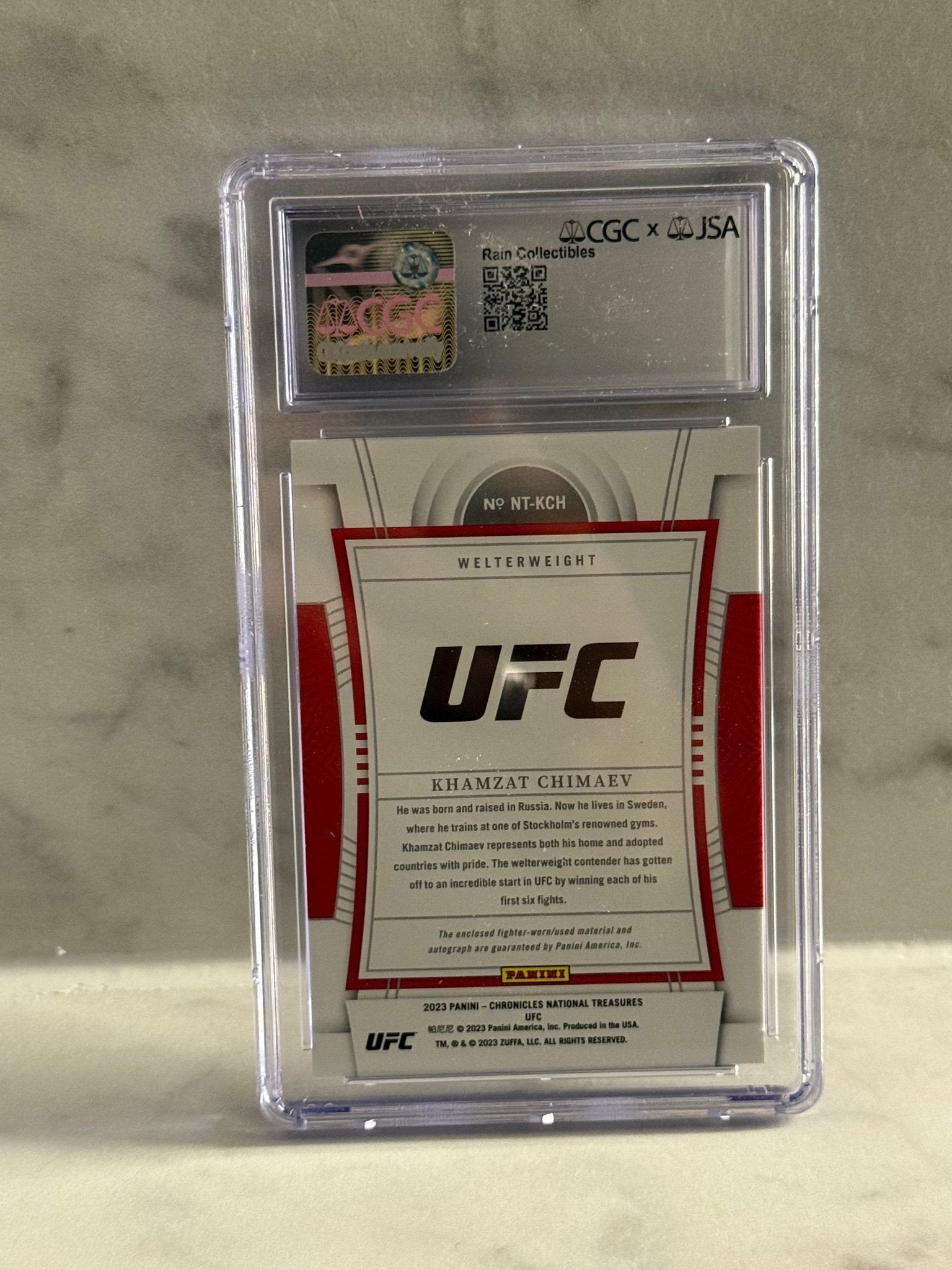 2023 Panini Chronicles UFC – Khamzat Chimaev National Treasures Patch Auto #/99 – Rookie Hit
