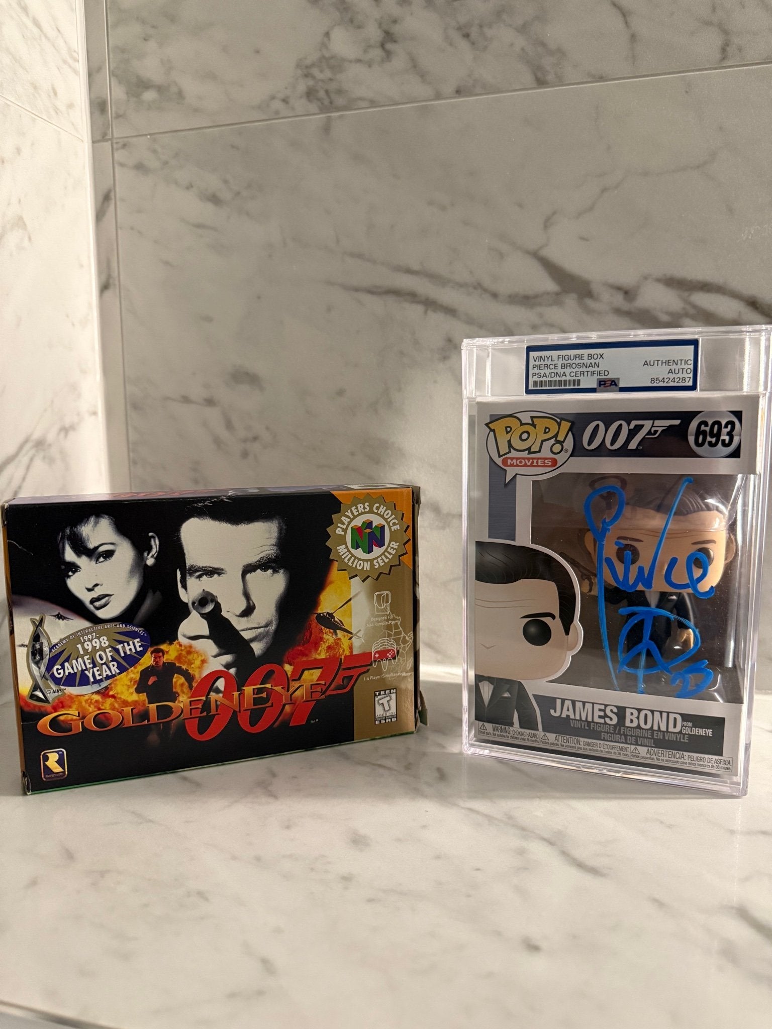 Pierce Brosnan Signed Funko Pop #693 – James Bond GoldenEye 007 – PSA Encapsulated